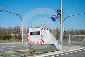 Modern camouflaged speed camera at the crossroads of an expressway