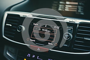 Modern car dashboard with bokeh background