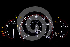 Car dashboard on black background closeup