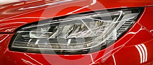 Modern Car exterior details.Headlight of a modern sport car.