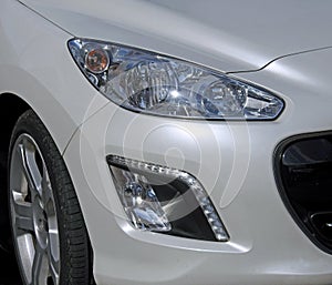 Modern car headlamps headlights lights lamps detail hood bonnet cars motors autos