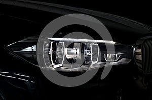 Modern car headlight with backlight.