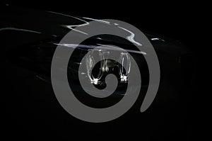 Lights reflections on the dark modern car.