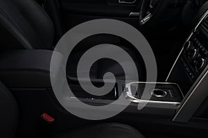 Modern car interior with automatic transmission shift lever.