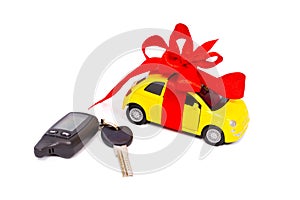 A modern car with a red bow and keys