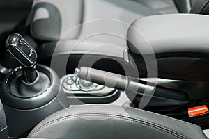 Close up of Modern car automatic gearbox and control buttons photo