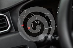 Modern car tachometer and dashboard with backlight.