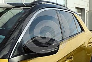 Modern car with tinting foil on window outdoors
