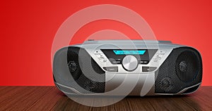 Modern CD Boombox with AM/FM Stereo Radio on wooden background. 3D rendering