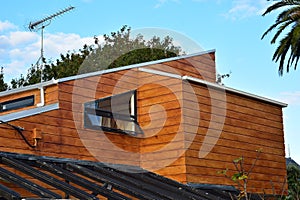 Modern cedar house with complex roof