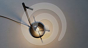 A modern ceiling light fixture is