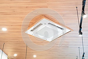 Modern ceiling mounted cassette type air conditioning system in coffee shop