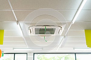 Modern ceiling mounted cassette type air conditioning system in coffee shop