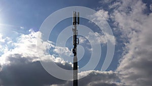 Modern cell phone tower against a cloudy sky 4k video