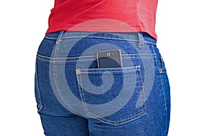 Modern cellphone sticking out of a jeans pocket