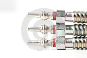 Modern ceramic glow plugs for warming up a diesel engine before starting. White background, isolate. Macro