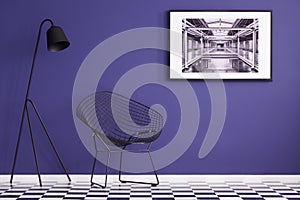 Modern chair, black lamp, checkered floor and painting on a purple wall