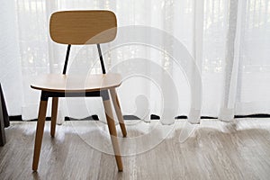 Modern chair on white drape texture background.