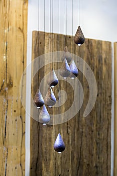 Modern chandelier, many small pendant lights in the form of drops of wood, eco style interior design