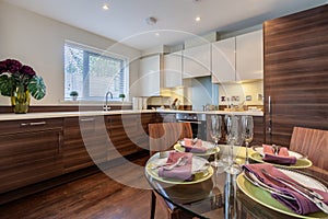 Modern chic luxury kitchen with glass table