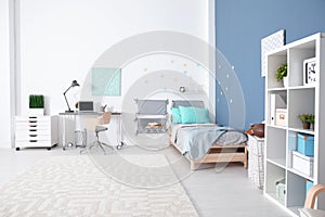 Modern child room interior with comfortable bed