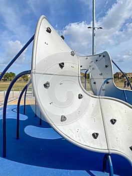 Modern Children playground activities in public park.