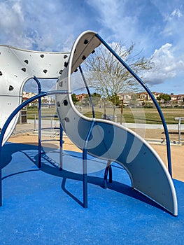 Modern Children playground activities in public park.