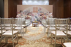 modern chinese wedding ceremony table and chairs setting for family meeting with family gifts. indoors.