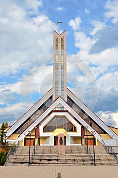 Modern christian church with heaven in background