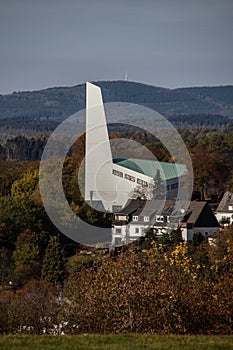 Modern church with steeple in the forest