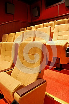 Modern cinema hall empty and beige comfortable seats