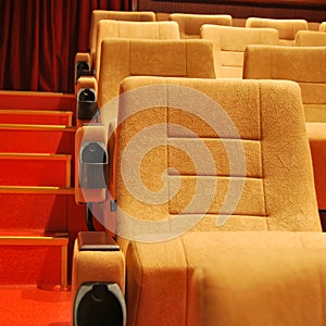 Modern cinema hall empty and beige comfortable seats