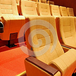 Modern cinema hall empty and beige comfortable seats