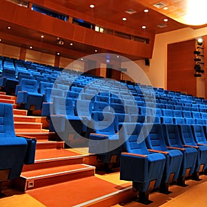 Modern cinema hall empty and blue comfortable seats