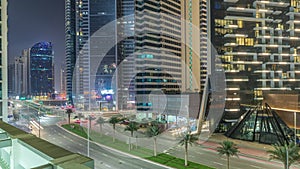 Modern city architecture in Business bay district. Panoramic view of Dubai's skyscrapers night timelapse