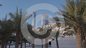 Modern city architecture and glass skyscrapers with unique camera movement - Abu Dhabi skyline from Qasr Al Hosn | World Trade Cen