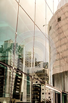 Modern city building window glass refections. Contemporary commercial exterior