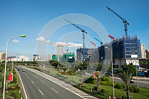 Modern city with highway traffic and building under construction. Hanoi city, Thang Long highway