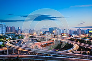 Modern city interchange overpass in nightfall