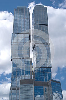 Modern city office buildings over cloudy sky