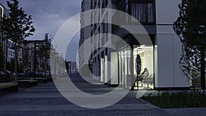 Modern city street on a summer day in the evening. Stock footage. Buildings of a new modern sleeping area on blue cloudy