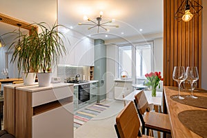 Modern classic white kitchen interior with dining zone