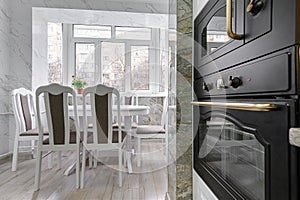 Modern classic white kitchen interior with dining zone