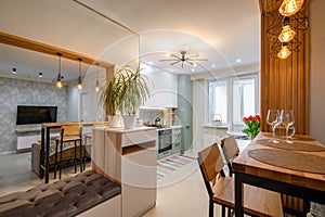 Modern classic white kitchen interior with dining zone