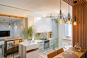 Modern classic white kitchen interior with dining zone