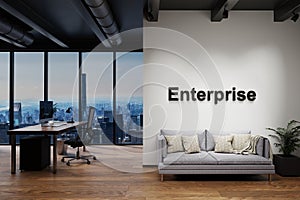 Modern clean office with computer workplace and large white wall and couch with skyline view, wall with enterprise lettering, 3D