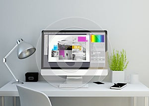 modern clean workspace with graphic design software on screen