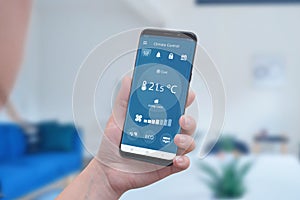 Modern climate control app interface on a smartphone in hand