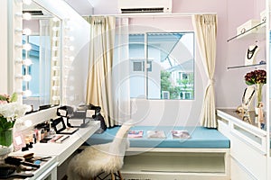 Modern closet room with make-up vanity table, mirror and cosmetics product in flat style house.