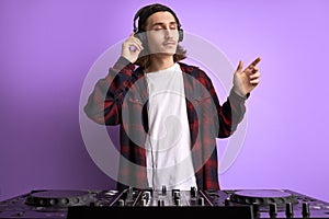 Modern club DJ playing mixing music on vinyl turntable, isolated